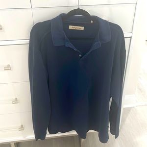 This is a dark blue Tommy Bahama, long sleeve cotton shirt. three button at neck